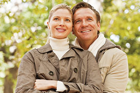 Photo of a man and woman smiling for a picture. Link to Life Stage Gift Planner Under Age 45 Situations.